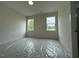 Bedroom has two large windows letting in an abundance of light and views at 5705 Flowery Meadow Ct, Wake Forest, NC 27587