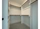 Walk-in closet with wooden racks and ample storage space at 5705 Flowery Meadow Ct, Wake Forest, NC 27587