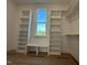 Walk-in closet with built-in shelves and a window with a view of the outdoors at 5705 Flowery Meadow Ct, Wake Forest, NC 27587