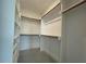 Spacious walk-in closet with wooden racks and shelves at 5705 Flowery Meadow Ct, Wake Forest, NC 27587