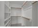 Walk-in closet with shelving, hanging rods, and carpeted flooring at 5705 Flowery Meadow Ct, Wake Forest, NC 27587