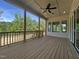 Expansive wooden deck with ceiling fan, overlooking a backyard at 5705 Flowery Meadow Ct, Wake Forest, NC 27587
