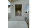 Close up of gray brick entrance with white front door and brick steps at 5705 Flowery Meadow Ct, Wake Forest, NC 27587