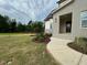 Stunning new home features light gray brick and professionally landscaped front yard at 5705 Flowery Meadow Ct, Wake Forest, NC 27587
