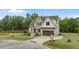 Attractive two-story home with a manicured lawn, a two-car garage and appealing facade at 5705 Flowery Meadow Ct, Wake Forest, NC 27587