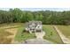 Beautiful new construction home with attractive landscaping, two-car garage, and neutral exterior at 5705 Flowery Meadow Ct, Wake Forest, NC 27587