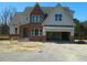 Charming two-story home with a brick and gray facade and a spacious two-car garage at 5705 Flowery Meadow Ct, Wake Forest, NC 27587