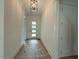 Bright foyer with white walls and a stylish front door at 5705 Flowery Meadow Ct, Wake Forest, NC 27587