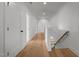 Upstairs hallway features hardwood floors, natural light, and access to multiple rooms at 5705 Flowery Meadow Ct, Wake Forest, NC 27587
