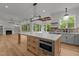 Spacious kitchen with large island, stainless steel appliances, and beautiful backyard views at 5705 Flowery Meadow Ct, Wake Forest, NC 27587
