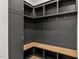 Well-organized mudroom with custom built-in shelving, bench seating, and ample storage at 5705 Flowery Meadow Ct, Wake Forest, NC 27587