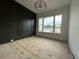 Office with dark accent wall, modern light fixture, and lots of natural light at 5705 Flowery Meadow Ct, Wake Forest, NC 27587