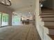 Open concept living space connecting to kitchen and featuring natural light and stairs at 5705 Flowery Meadow Ct, Wake Forest, NC 27587