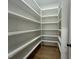 Walk-in pantry offering generous storage space with shelving at 5705 Flowery Meadow Ct, Wake Forest, NC 27587