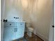 Charming powder room with white vanity, modern fixtures and finishes at 5705 Flowery Meadow Ct, Wake Forest, NC 27587
