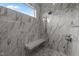 Modern shower with marble tiling, a rainfall shower head, and built-in bench at 5705 Flowery Meadow Ct, Wake Forest, NC 27587