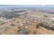 Aerial view features properties nestled in a community with lush surroundings and a serene pond at 58 Atkins Village Ct, Fuquay Varina, NC 27526