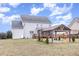 The backyard features a pergola and ample space for outdoor activities at 58 Atkins Village Ct, Fuquay Varina, NC 27526