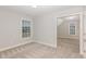 Cozy bedroom with neutral carpet, light gray walls, and a window with blinds at 58 Atkins Village Ct, Fuquay Varina, NC 27526
