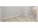 Bedroom with neutral carpet, light gray walls, and a doorway leading to another room at 58 Atkins Village Ct, Fuquay Varina, NC 27526