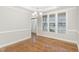 Dining area featuring hardwood floors, window, and access to the home's entry at 58 Atkins Village Ct, Fuquay Varina, NC 27526