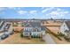 Charming two-story home with a manicured lawn, mature trees, and a long driveway, perfect for suburban living at 58 Atkins Village Ct, Fuquay Varina, NC 27526
