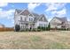 Beautiful two-story home features a spacious front yard with mature landscaping and classic architectural details at 58 Atkins Village Ct Ct, Fuquay Varina, NC 27526