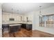 Kitchen with a large island, pendant lighting and white cabinets at 58 Atkins Village Ct Ct, Fuquay Varina, NC 27526