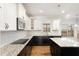 Bright kitchen with island, granite countertops and stainless appliances at 58 Atkins Village Ct, Fuquay Varina, NC 27526