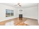 Inviting living room with hardwood floors, a fireplace, large windows, and stylish trim accents at 58 Atkins Village Ct, Fuquay Varina, NC 27526