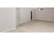 Spacious primary bedroom with plush carpeting and access to ensuite bathroom at 58 Atkins Village Ct, Fuquay Varina, NC 27526