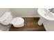 Bathroom featuring a pedestal sink and a toilet, all in a light color scheme with vinyl flooring at 5803 Osprey Cove Dr, Raleigh, NC 27604