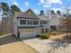 Charming two-story home featuring a two-car garage, well-maintained lawn, and classic architectural details at 60 Sutherland Dr, Franklinton, NC 27525