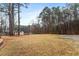 Expansive backyard featuring a well-maintained lawn, mature trees, and plenty of room for outdoor activities at 628 Stratford Dr, Zebulon, NC 27597