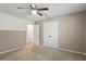 Bedroom featuring a ceiling fan, standard window, and closet at 628 Stratford Dr, Zebulon, NC 27597
