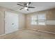 Bedroom with double door closet, standard window, and ceiling fan at 628 Stratford Dr, Zebulon, NC 27597