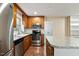 Updated kitchen featuring stainless steel appliances, wood cabinets, and island at 628 Stratford Dr, Zebulon, NC 27597