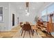 Elegant dining room with modern light fixture and stylish furniture at 6509 Archwood Ave, Raleigh, NC 27616