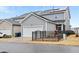 Angle shot of the garage showing the white garage door, solar panels and fenced in yard at 6509 Archwood Ave, Raleigh, NC 27616