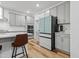 Contemporary kitchen featuring stainless steel appliances and sleek cabinetry at 6509 Archwood Ave, Raleigh, NC 27616