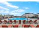 Wide angle view of the community pool with lounge chairs, umbrellas and seating at 6509 Archwood Ave, Raleigh, NC 27616