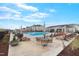 View of the community pool with lounge chairs, umbrellas, and tables at 6509 Archwood Ave, Raleigh, NC 27616