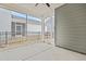 View of the screened porch area showing the black fence and the adjacent building at 6509 Archwood Ave, Raleigh, NC 27616