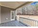 View of spacious back deck with gray wooden railing and ceiling, overlooking backyard at 6509 Sunset Manor Dr, Wake Forest, NC 27587