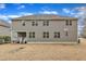 Expansive two-story home featuring multiple windows and a covered back patio at 6509 Sunset Manor Dr, Wake Forest, NC 27587