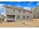 Two-story home featuring multiple windows and a covered back patio with access to the yard at 6509 Sunset Manor Dr, Wake Forest, NC 27587