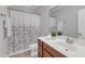 Well-lit bathroom with a shower and a single sink, offering comfort and style at 6509 Sunset Manor Dr, Wake Forest, NC 27587