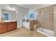 A modern bathroom features a soaking tub and separate glass-enclosed shower at 6509 Sunset Manor Dr, Wake Forest, NC 27587