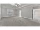 Spacious bedroom featuring carpet, ceiling fan, and large windows at 6509 Sunset Manor Dr, Wake Forest, NC 27587