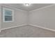 Bedroom with large window and neutral walls, creating a bright and airy feel at 6509 Sunset Manor Dr, Wake Forest, NC 27587